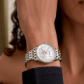 a77320e61a2a1-navitimer-32-whitesteel-wrist-shot-ecom.png