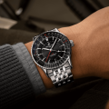 navitimer-41-gmt-a32310251b1a1-black-metal-bracelet-wrist-shot-ecom.png